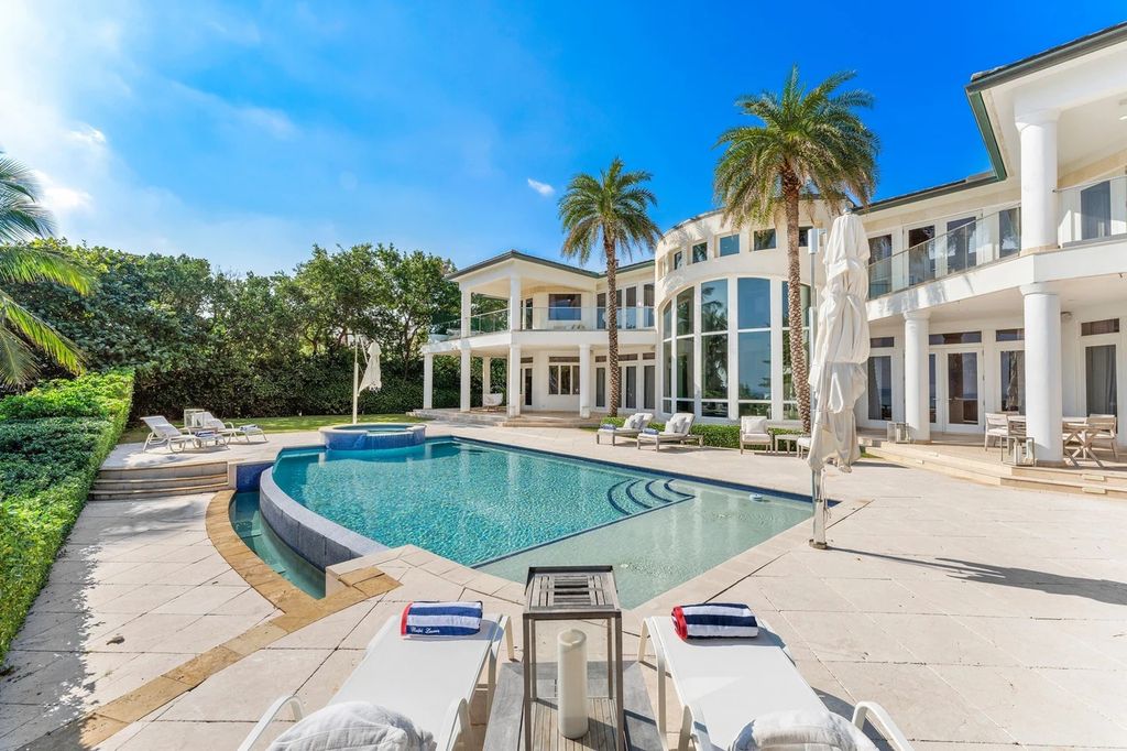 317 Ocean Boulevard, Golden Beach, Florida is an exceptional ocean front estate with luxurious amenities including formal dining room with maple paneling, movie theater, elevator, help quarters, finished basement, gym, and 2 large storage rooms. 