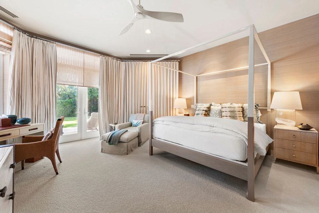 317 Ocean Boulevard, Golden Beach, Florida is an exceptional ocean front estate with luxurious amenities including formal dining room with maple paneling, movie theater, elevator, help quarters, finished basement, gym, and 2 large storage rooms. 