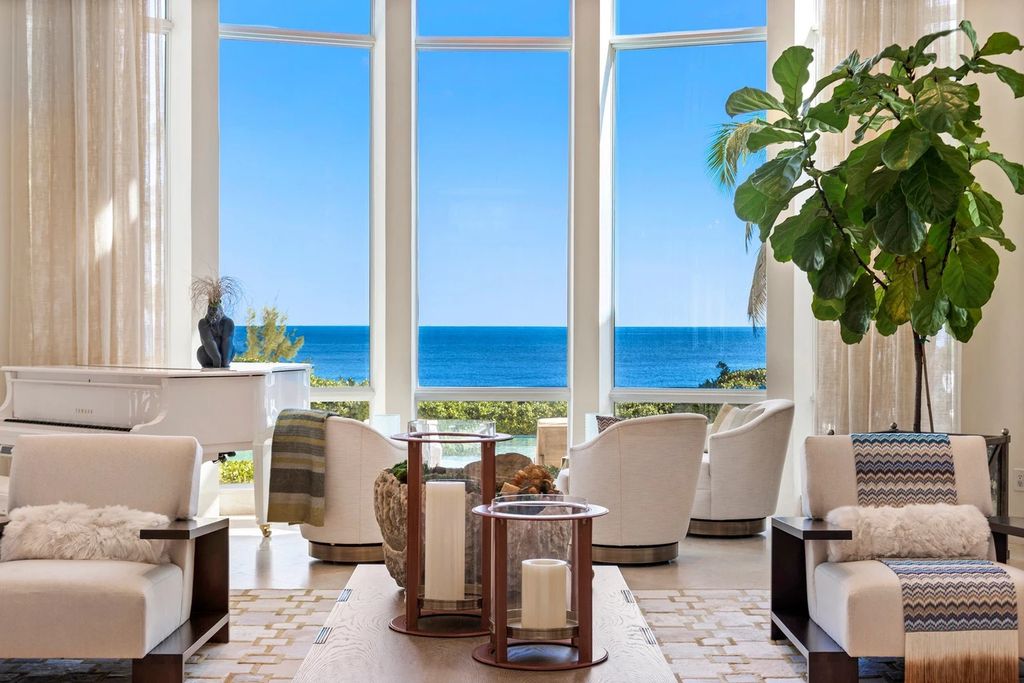 317 Ocean Boulevard, Golden Beach, Florida is an exceptional ocean front estate with luxurious amenities including formal dining room with maple paneling, movie theater, elevator, help quarters, finished basement, gym, and 2 large storage rooms. 