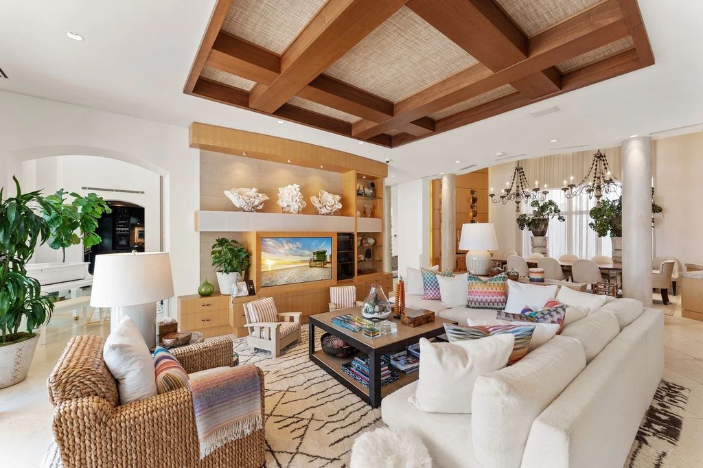317 Ocean Boulevard, Golden Beach, Florida is an exceptional ocean front estate with luxurious amenities including formal dining room with maple paneling, movie theater, elevator, help quarters, finished basement, gym, and 2 large storage rooms. 
