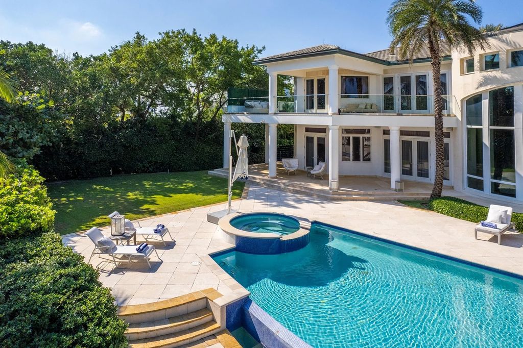 317 Ocean Boulevard, Golden Beach, Florida is an exceptional ocean front estate with luxurious amenities including formal dining room with maple paneling, movie theater, elevator, help quarters, finished basement, gym, and 2 large storage rooms. 