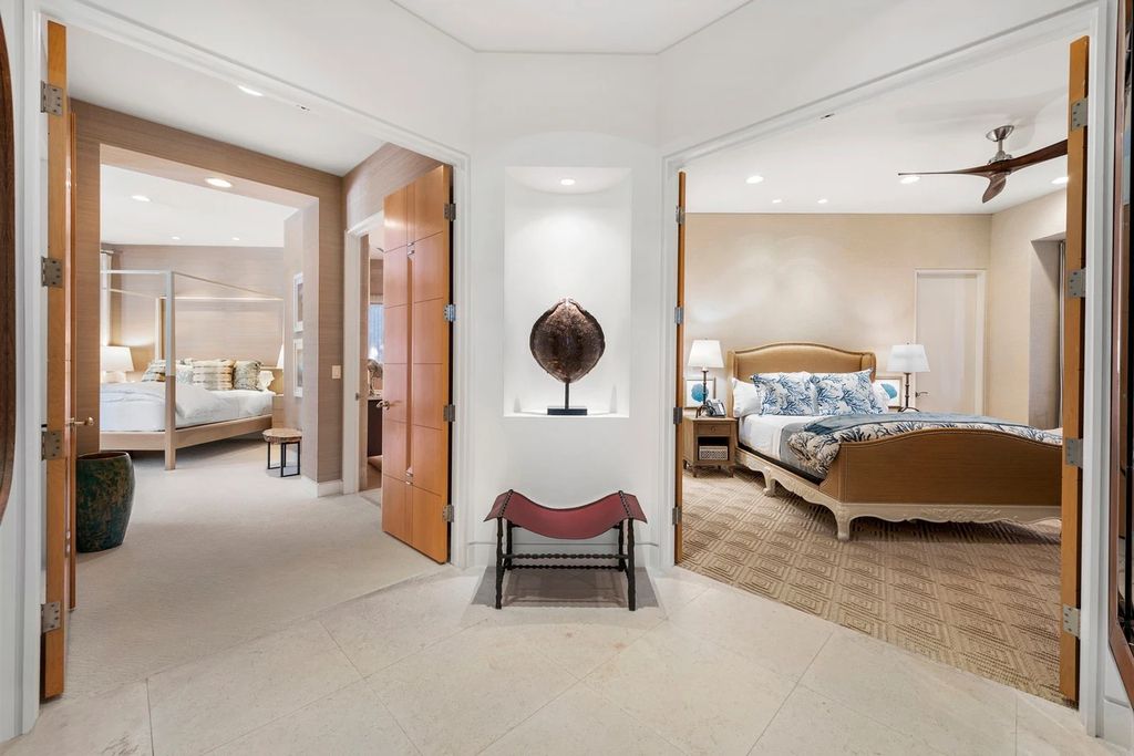 317 Ocean Boulevard, Golden Beach, Florida is an exceptional ocean front estate with luxurious amenities including formal dining room with maple paneling, movie theater, elevator, help quarters, finished basement, gym, and 2 large storage rooms. 