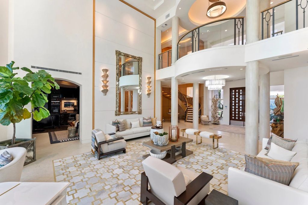 317 Ocean Boulevard, Golden Beach, Florida is an exceptional ocean front estate with luxurious amenities including formal dining room with maple paneling, movie theater, elevator, help quarters, finished basement, gym, and 2 large storage rooms. 