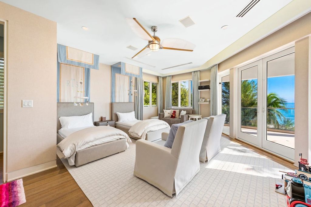 317 Ocean Boulevard, Golden Beach, Florida is an exceptional ocean front estate with luxurious amenities including formal dining room with maple paneling, movie theater, elevator, help quarters, finished basement, gym, and 2 large storage rooms. 