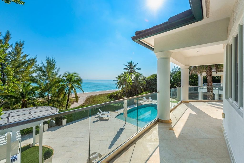 317 Ocean Boulevard, Golden Beach, Florida is an exceptional ocean front estate with luxurious amenities including formal dining room with maple paneling, movie theater, elevator, help quarters, finished basement, gym, and 2 large storage rooms. 