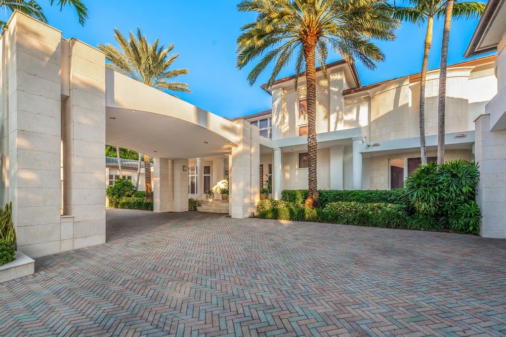 317 Ocean Boulevard, Golden Beach, Florida is an exceptional ocean front estate with luxurious amenities including formal dining room with maple paneling, movie theater, elevator, help quarters, finished basement, gym, and 2 large storage rooms. 
