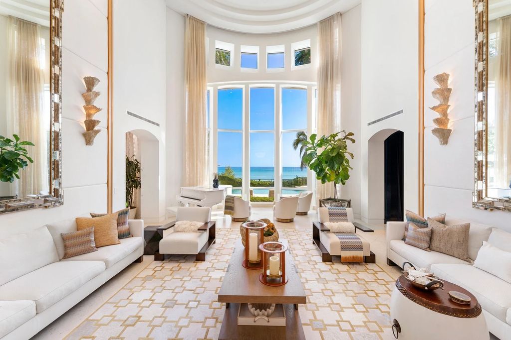317 Ocean Boulevard, Golden Beach, Florida is an exceptional ocean front estate with luxurious amenities including formal dining room with maple paneling, movie theater, elevator, help quarters, finished basement, gym, and 2 large storage rooms. 