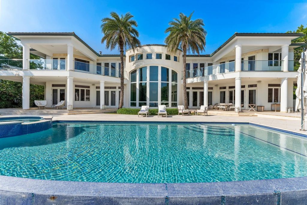 317 Ocean Boulevard, Golden Beach, Florida is an exceptional ocean front estate with luxurious amenities including formal dining room with maple paneling, movie theater, elevator, help quarters, finished basement, gym, and 2 large storage rooms. 