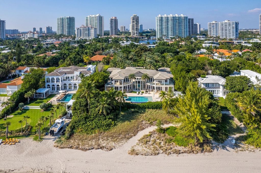317 Ocean Boulevard, Golden Beach, Florida is an exceptional ocean front estate with luxurious amenities including formal dining room with maple paneling, movie theater, elevator, help quarters, finished basement, gym, and 2 large storage rooms. 