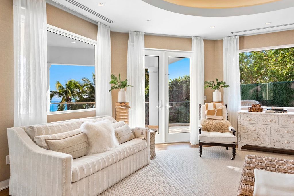 317 Ocean Boulevard, Golden Beach, Florida is an exceptional ocean front estate with luxurious amenities including formal dining room with maple paneling, movie theater, elevator, help quarters, finished basement, gym, and 2 large storage rooms. 