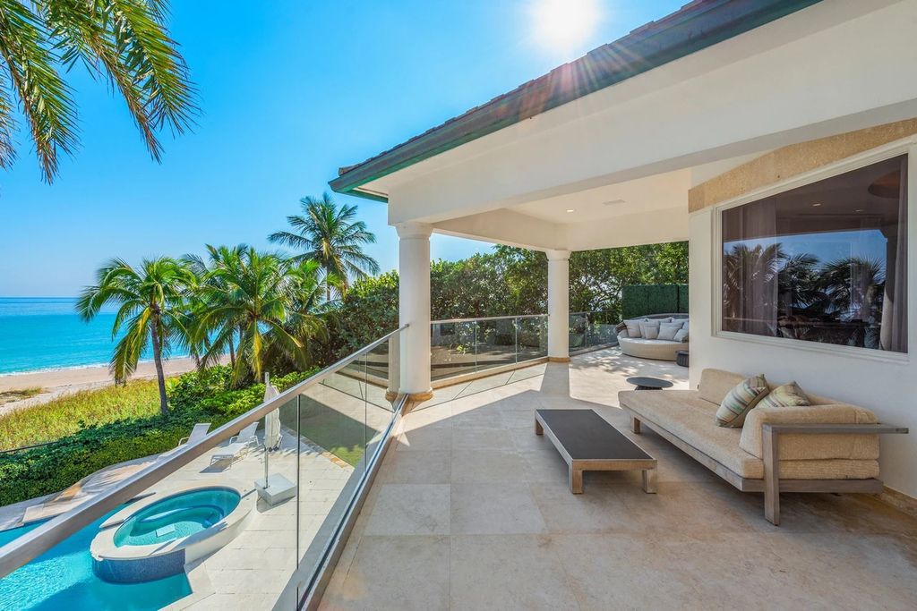 317 Ocean Boulevard, Golden Beach, Florida is an exceptional ocean front estate with luxurious amenities including formal dining room with maple paneling, movie theater, elevator, help quarters, finished basement, gym, and 2 large storage rooms. 