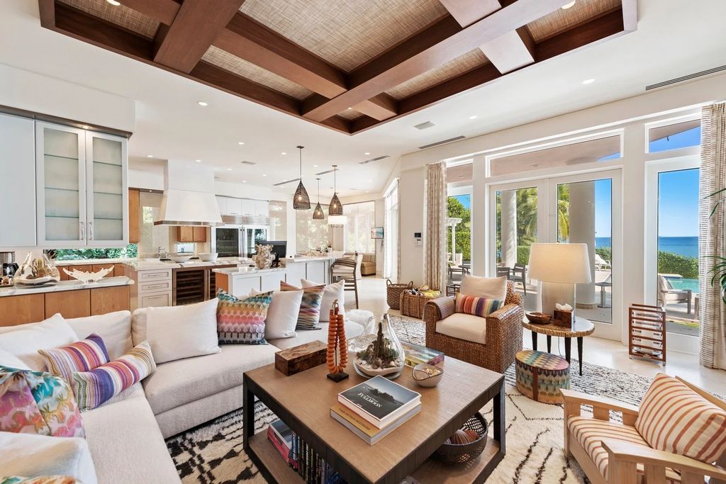 317 Ocean Boulevard, Golden Beach, Florida is an exceptional ocean front estate with luxurious amenities including formal dining room with maple paneling, movie theater, elevator, help quarters, finished basement, gym, and 2 large storage rooms. 