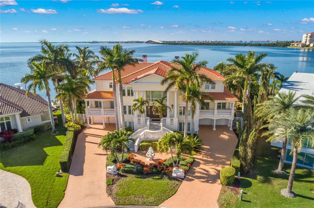 6199 54th St S, Saint Petersburg, Florida is a waterfront estate was designed to enjoy entertaining and outdoor living with expansive waterfront decks to experience a seamless indoor outdoor living with waterfall surrounded by mature privacy landscape.
