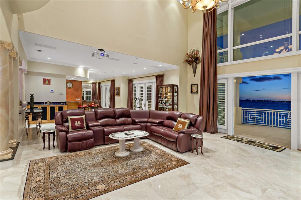 6199 54th St S, Saint Petersburg, Florida is a waterfront estate was designed to enjoy entertaining and outdoor living with expansive waterfront decks to experience a seamless indoor outdoor living with waterfall surrounded by mature privacy landscape.