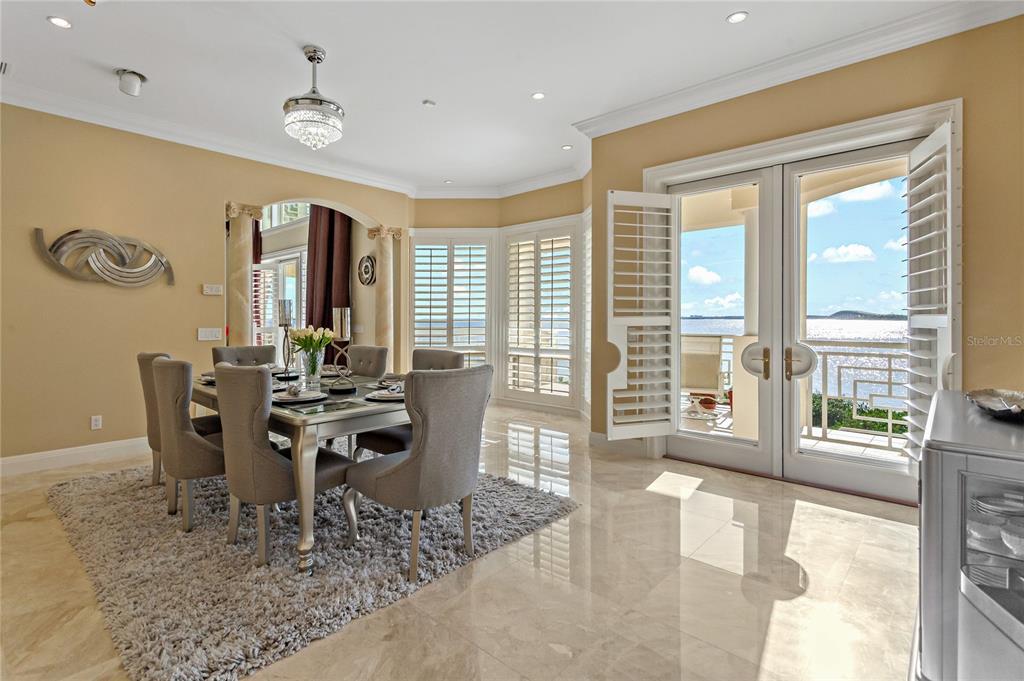 6199 54th St S, Saint Petersburg, Florida is a waterfront estate was designed to enjoy entertaining and outdoor living with expansive waterfront decks to experience a seamless indoor outdoor living with waterfall surrounded by mature privacy landscape.