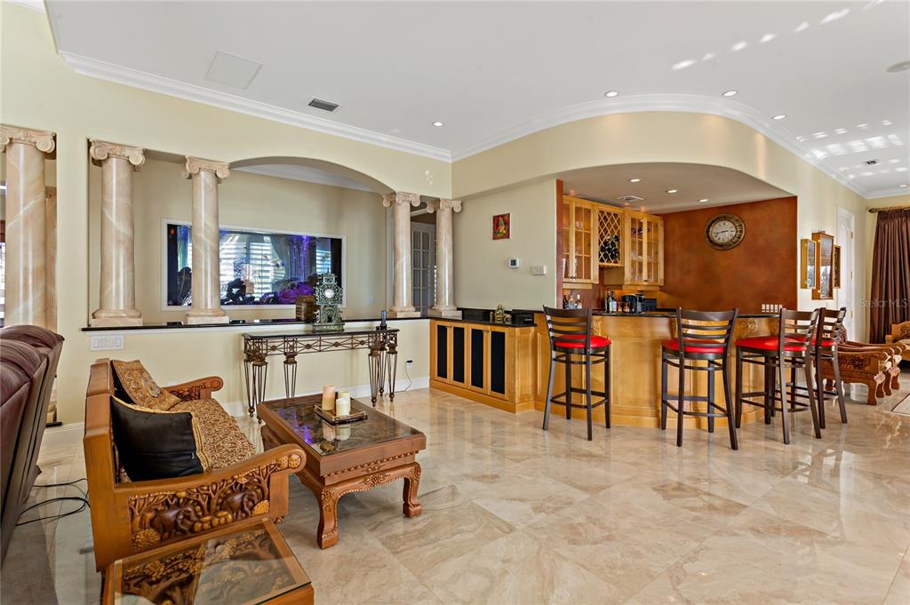 6199 54th St S, Saint Petersburg, Florida is a waterfront estate was designed to enjoy entertaining and outdoor living with expansive waterfront decks to experience a seamless indoor outdoor living with waterfall surrounded by mature privacy landscape.