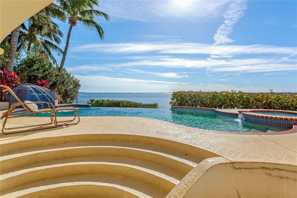6199 54th St S, Saint Petersburg, Florida is a waterfront estate was designed to enjoy entertaining and outdoor living with expansive waterfront decks to experience a seamless indoor outdoor living with waterfall surrounded by mature privacy landscape.