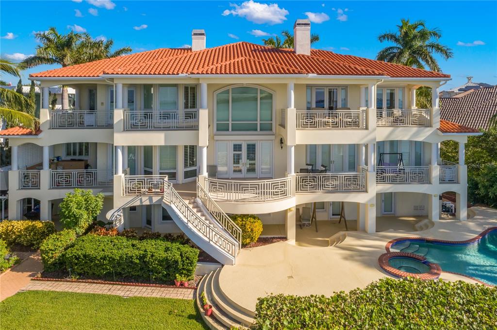 6199 54th St S, Saint Petersburg, Florida is a waterfront estate was designed to enjoy entertaining and outdoor living with expansive waterfront decks to experience a seamless indoor outdoor living with waterfall surrounded by mature privacy landscape.