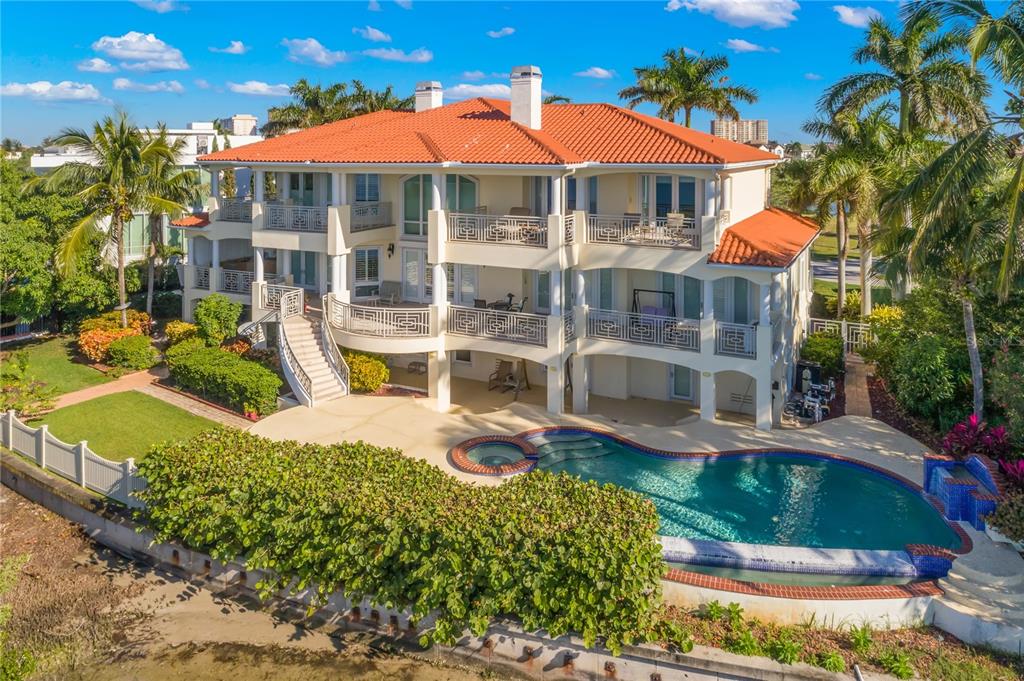 6199 54th St S, Saint Petersburg, Florida is a waterfront estate was designed to enjoy entertaining and outdoor living with expansive waterfront decks to experience a seamless indoor outdoor living with waterfall surrounded by mature privacy landscape.