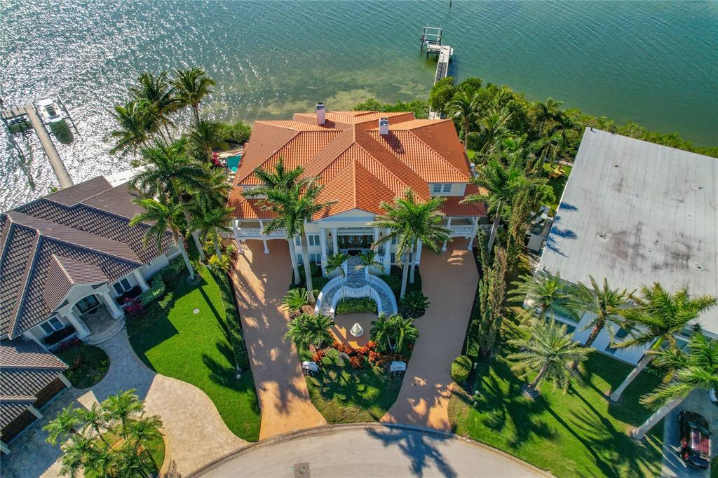 6199 54th St S, Saint Petersburg, Florida is a waterfront estate was designed to enjoy entertaining and outdoor living with expansive waterfront decks to experience a seamless indoor outdoor living with waterfall surrounded by mature privacy landscape.