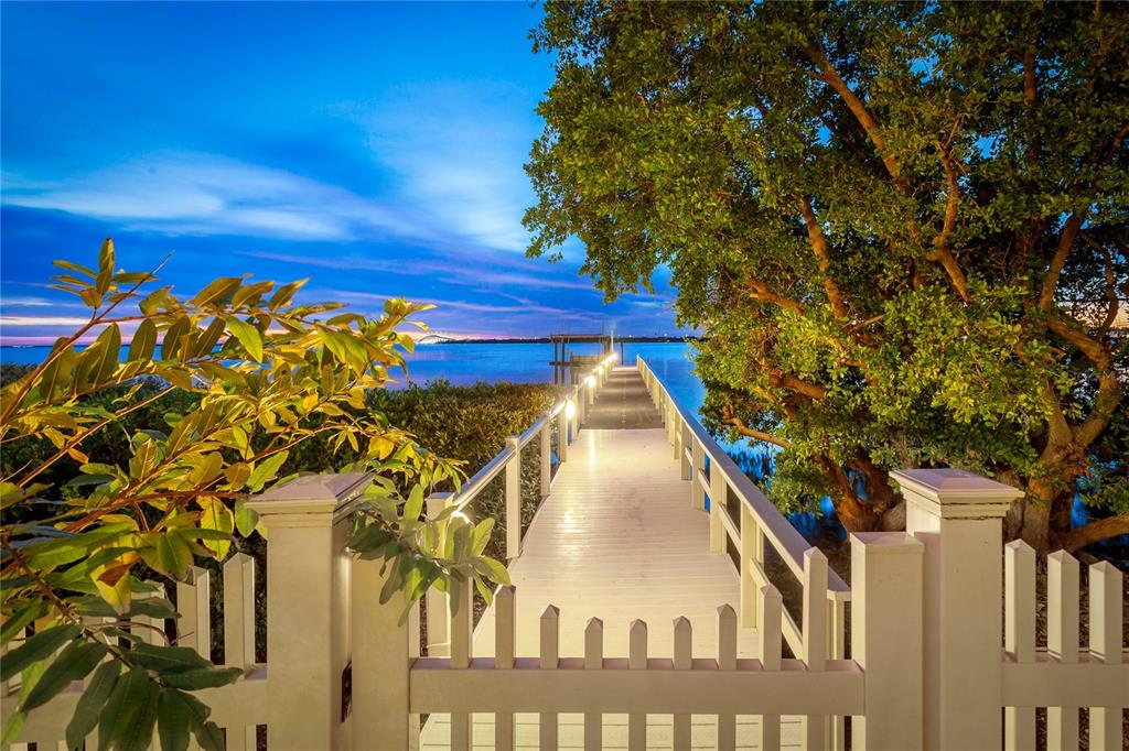 6199 54th St S, Saint Petersburg, Florida is a waterfront estate was designed to enjoy entertaining and outdoor living with expansive waterfront decks to experience a seamless indoor outdoor living with waterfall surrounded by mature privacy landscape.