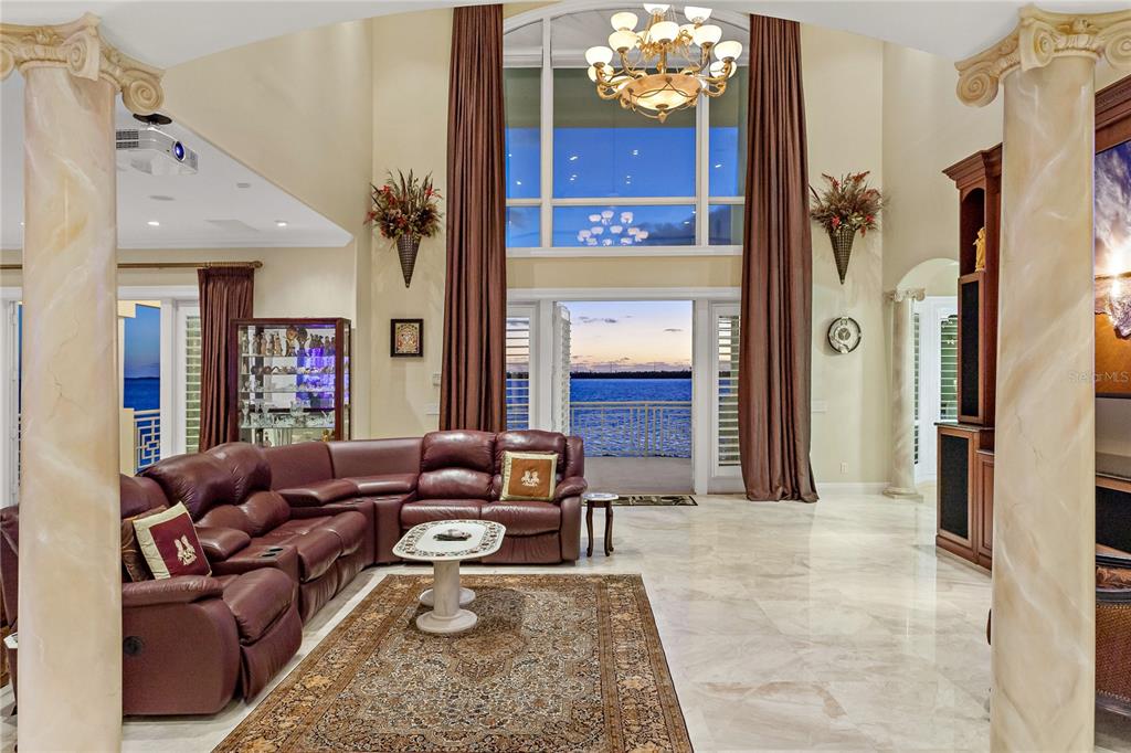 6199 54th St S, Saint Petersburg, Florida is a waterfront estate was designed to enjoy entertaining and outdoor living with expansive waterfront decks to experience a seamless indoor outdoor living with waterfall surrounded by mature privacy landscape.