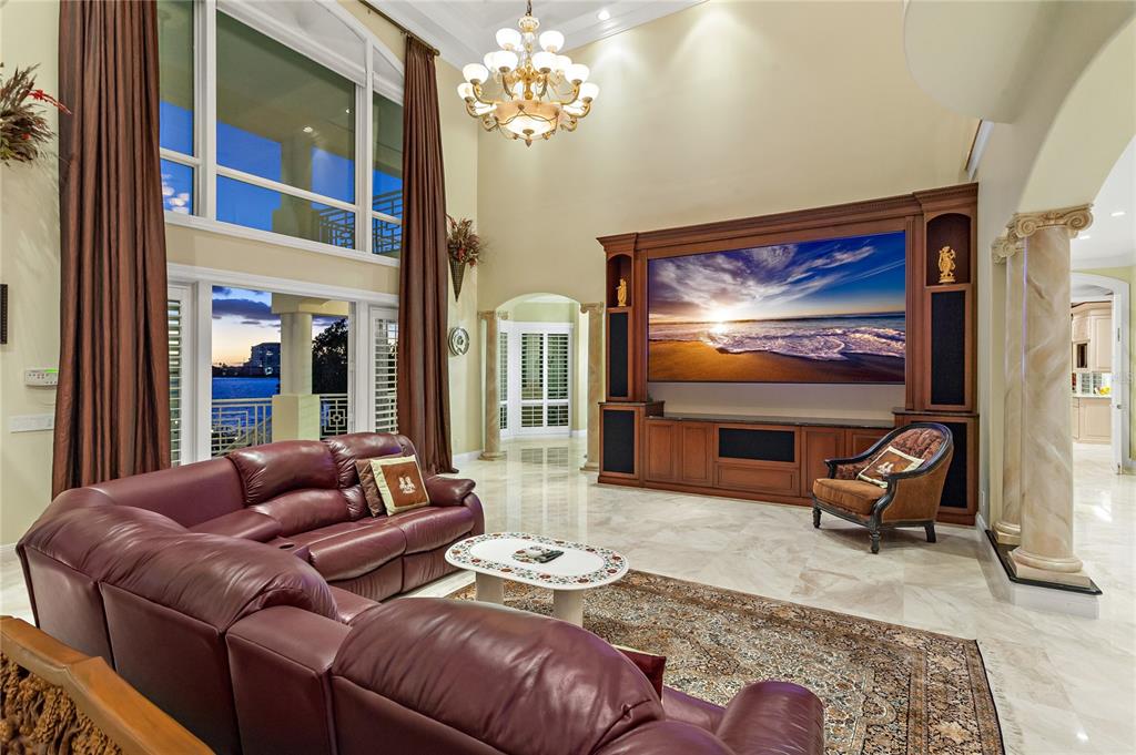 6199 54th St S, Saint Petersburg, Florida is a waterfront estate was designed to enjoy entertaining and outdoor living with expansive waterfront decks to experience a seamless indoor outdoor living with waterfall surrounded by mature privacy landscape.