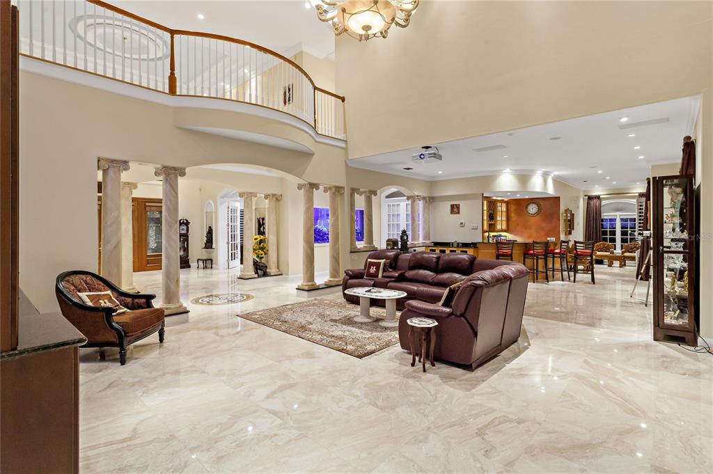 6199 54th St S, Saint Petersburg, Florida is a waterfront estate was designed to enjoy entertaining and outdoor living with expansive waterfront decks to experience a seamless indoor outdoor living with waterfall surrounded by mature privacy landscape.