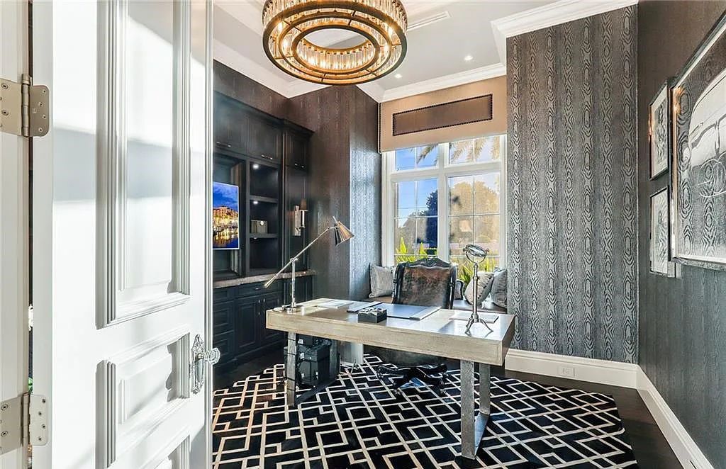 482 Ridge Drive, Naples, Florida, is located in a desirable Naples neighborhood, just minutes from Vanderbilt Beach, Mercato, and Waterside shops. This stunning home was built with meticulous attention to detail, including a butterfly staircase and marble floors.