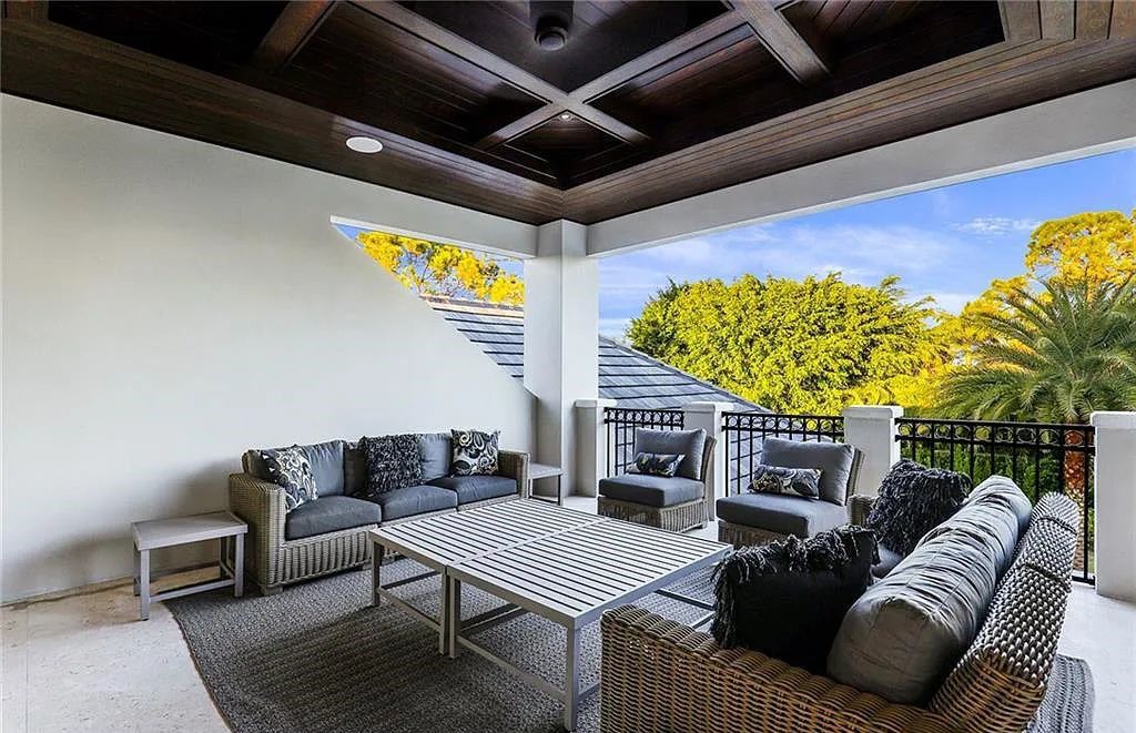 482 Ridge Drive, Naples, Florida, is located in a desirable Naples neighborhood, just minutes from Vanderbilt Beach, Mercato, and Waterside shops. This stunning home was built with meticulous attention to detail, including a butterfly staircase and marble floors.