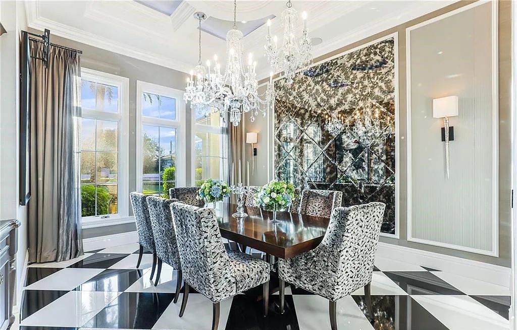 482 Ridge Drive, Naples, Florida, is located in a desirable Naples neighborhood, just minutes from Vanderbilt Beach, Mercato, and Waterside shops. This stunning home was built with meticulous attention to detail, including a butterfly staircase and marble floors.