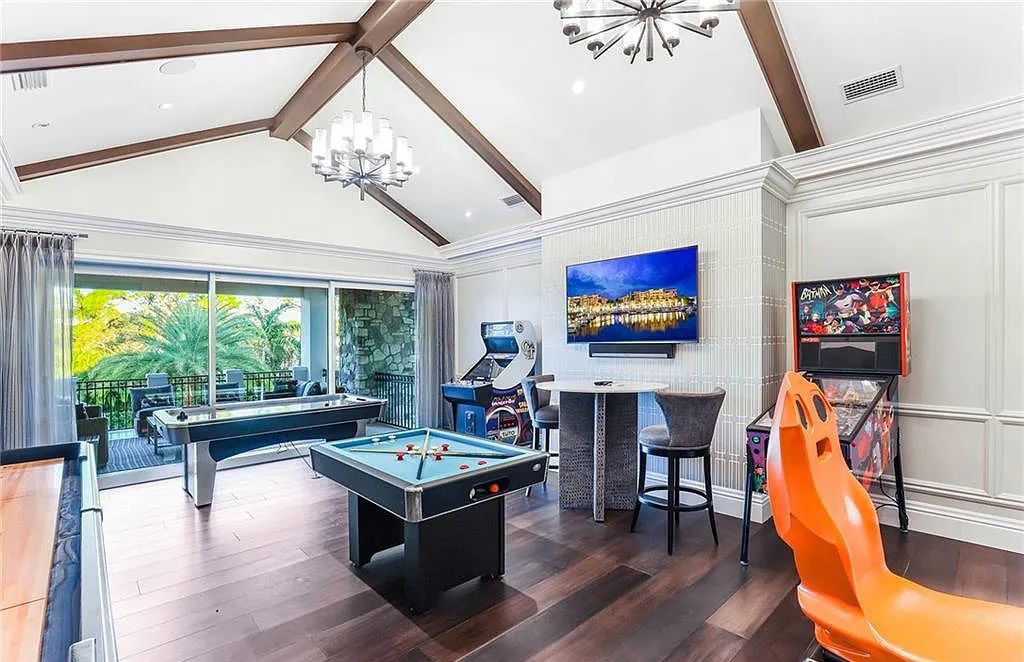 482 Ridge Drive, Naples, Florida, is located in a desirable Naples neighborhood, just minutes from Vanderbilt Beach, Mercato, and Waterside shops. This stunning home was built with meticulous attention to detail, including a butterfly staircase and marble floors.