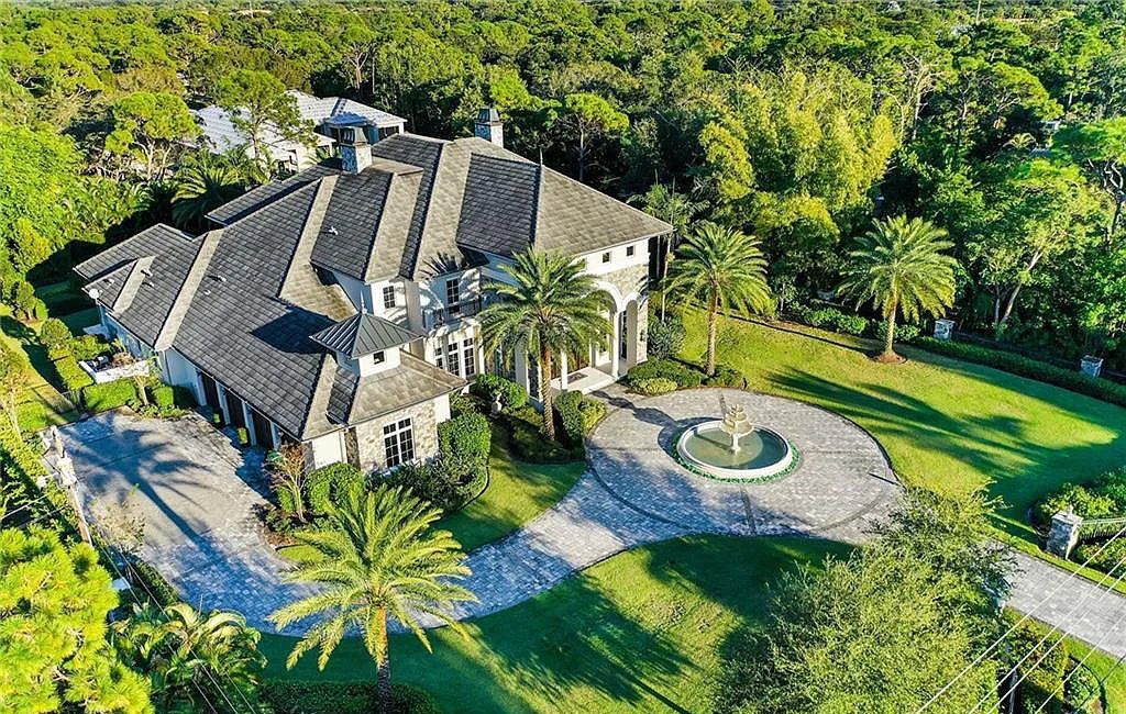 482 Ridge Drive, Naples, Florida, is located in a desirable Naples neighborhood, just minutes from Vanderbilt Beach, Mercato, and Waterside shops. This stunning home was built with meticulous attention to detail, including a butterfly staircase and marble floors.