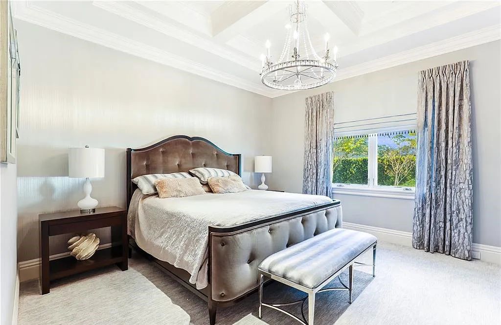 482 Ridge Drive, Naples, Florida, is located in a desirable Naples neighborhood, just minutes from Vanderbilt Beach, Mercato, and Waterside shops. This stunning home was built with meticulous attention to detail, including a butterfly staircase and marble floors.