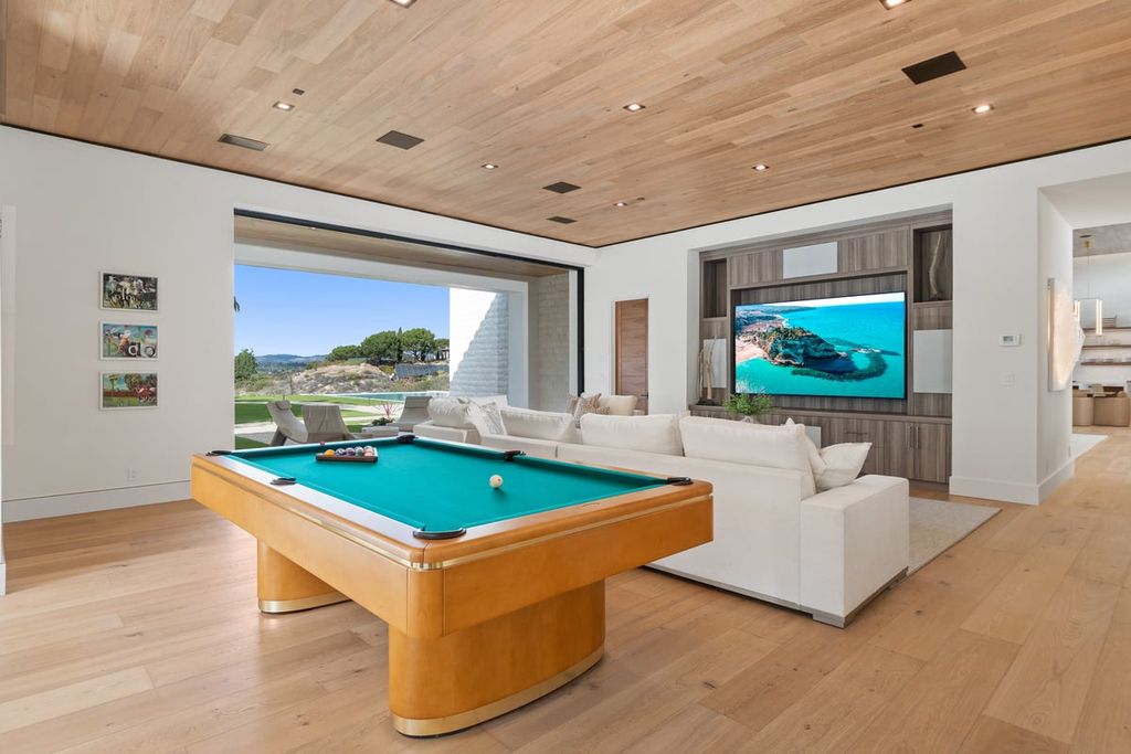 5940 Ladys Secret Drive, Rancho Santa Fe, California is a brand new estate tucked away in a convenient and prestigious gated community and sitting on a premier 2.43 acre site boasting the epitome of Resort Living.