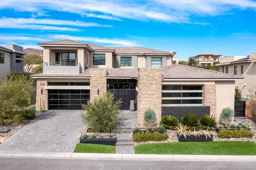 11448 Opal Springs Way, Las Vegas, Nevada is a guard-gated designer dream home with updated amenities including French oak hardwood flooring, silver travertine decking, closets, light fixtures, Control4 home automation, whole-home sound, and more.