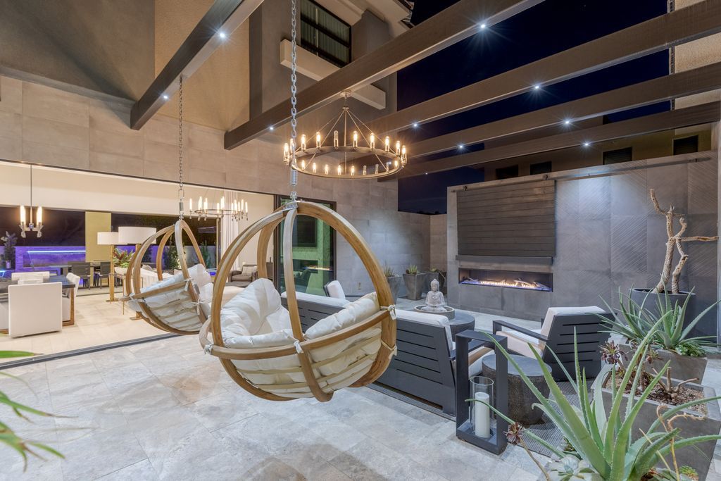 11448 Opal Springs Way, Las Vegas, Nevada is a guard-gated designer dream home with updated amenities including French oak hardwood flooring, silver travertine decking, closets, light fixtures, Control4 home automation, whole-home sound, and more.