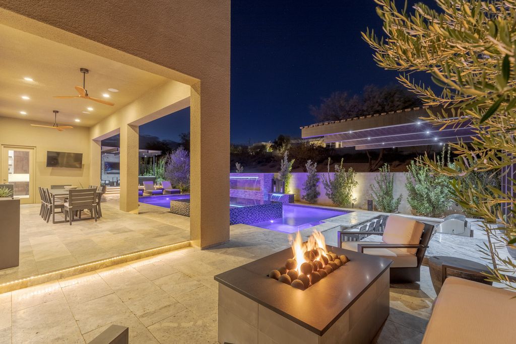 11448 Opal Springs Way, Las Vegas, Nevada is a guard-gated designer dream home with updated amenities including French oak hardwood flooring, silver travertine decking, closets, light fixtures, Control4 home automation, whole-home sound, and more.