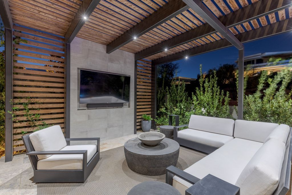11448 Opal Springs Way, Las Vegas, Nevada is a guard-gated designer dream home with updated amenities including French oak hardwood flooring, silver travertine decking, closets, light fixtures, Control4 home automation, whole-home sound, and more.