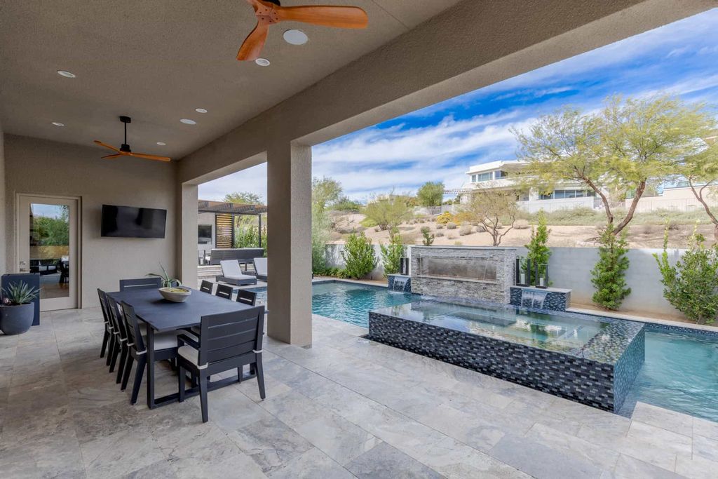 11448 Opal Springs Way, Las Vegas, Nevada is a guard-gated designer dream home with updated amenities including French oak hardwood flooring, silver travertine decking, closets, light fixtures, Control4 home automation, whole-home sound, and more.