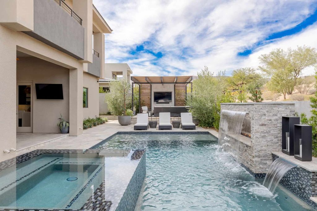 11448 Opal Springs Way, Las Vegas, Nevada is a guard-gated designer dream home with updated amenities including French oak hardwood flooring, silver travertine decking, closets, light fixtures, Control4 home automation, whole-home sound, and more.