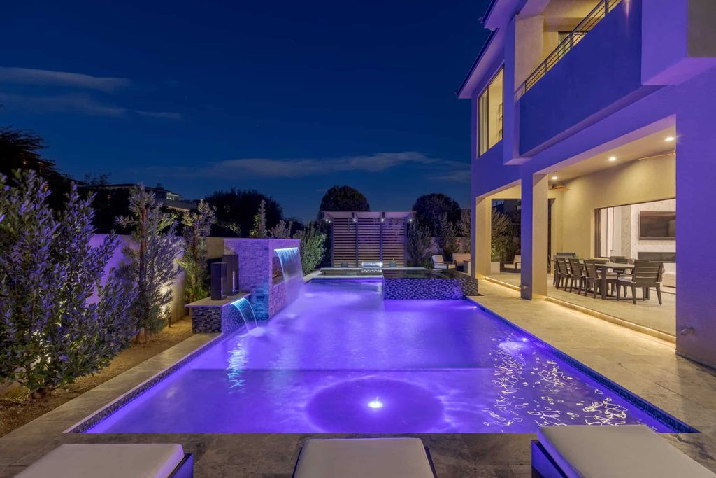 11448 Opal Springs Way, Las Vegas, Nevada is a guard-gated designer dream home with updated amenities including French oak hardwood flooring, silver travertine decking, closets, light fixtures, Control4 home automation, whole-home sound, and more.