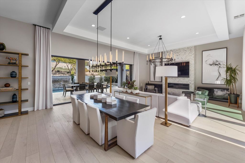 11448 Opal Springs Way, Las Vegas, Nevada is a guard-gated designer dream home with updated amenities including French oak hardwood flooring, silver travertine decking, closets, light fixtures, Control4 home automation, whole-home sound, and more.