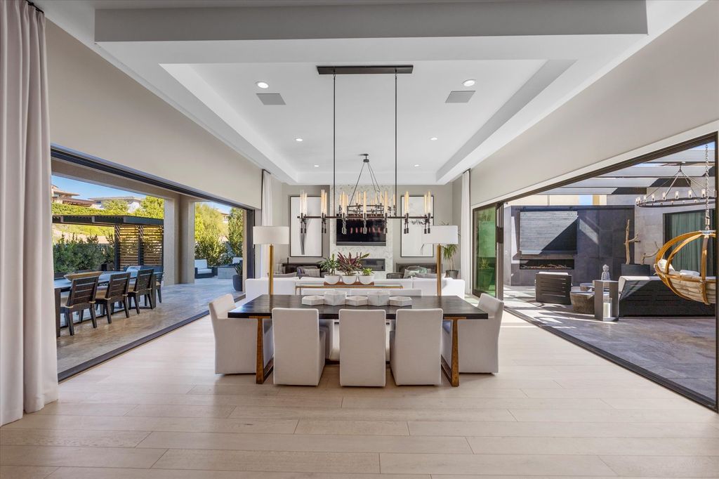 11448 Opal Springs Way, Las Vegas, Nevada is a guard-gated designer dream home with updated amenities including French oak hardwood flooring, silver travertine decking, closets, light fixtures, Control4 home automation, whole-home sound, and more.