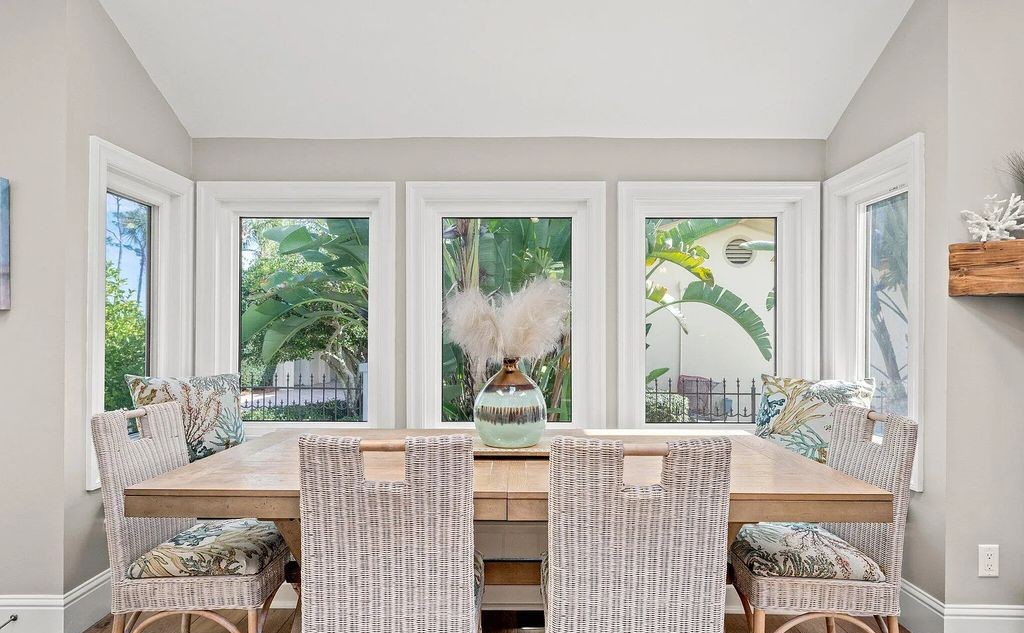 4600 Bay Point Road, Panama City Beach, Florida, is an exceptionally luxurious home with a Tropical Poolside Oasis with smart furnishings, soaring vaulted wood beam ceilings, a curving staircase, and an expansive living room featuring a well-appointed fireplace and triple French doors that lead to the elevated deck. This Home in Panama City Beach offers 6 bedrooms and 8 bathrooms with over 6.000 square feet of living spaces.