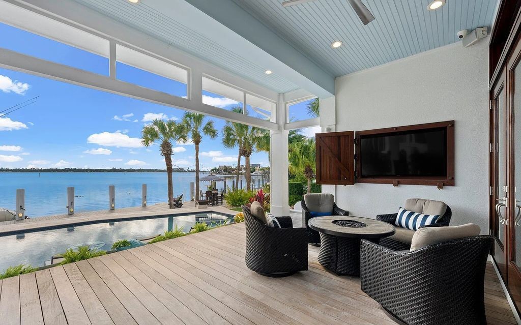 4600 Bay Point Road, Panama City Beach, Florida, is an exceptionally luxurious home with a Tropical Poolside Oasis with smart furnishings, soaring vaulted wood beam ceilings, a curving staircase, and an expansive living room featuring a well-appointed fireplace and triple French doors that lead to the elevated deck. This Home in Panama City Beach offers 6 bedrooms and 8 bathrooms with over 6.000 square feet of living spaces.