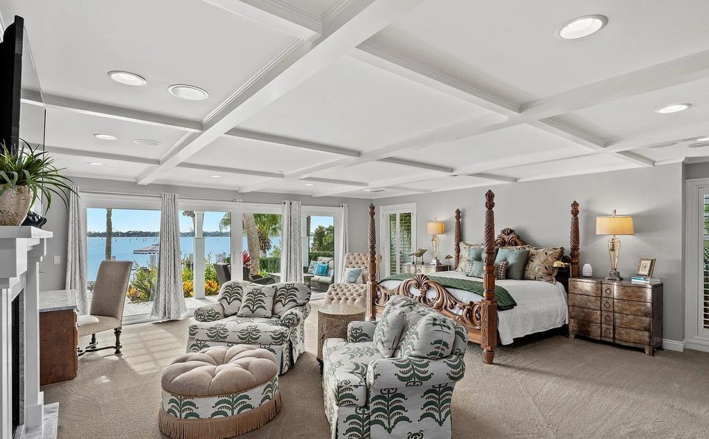 4600 Bay Point Road, Panama City Beach, Florida, is an exceptionally luxurious home with a Tropical Poolside Oasis with smart furnishings, soaring vaulted wood beam ceilings, a curving staircase, and an expansive living room featuring a well-appointed fireplace and triple French doors that lead to the elevated deck. This Home in Panama City Beach offers 6 bedrooms and 8 bathrooms with over 6.000 square feet of living spaces.