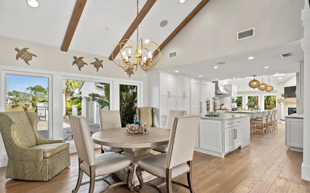 4600 Bay Point Road, Panama City Beach, Florida, is an exceptionally luxurious home with a Tropical Poolside Oasis with smart furnishings, soaring vaulted wood beam ceilings, a curving staircase, and an expansive living room featuring a well-appointed fireplace and triple French doors that lead to the elevated deck. This Home in Panama City Beach offers 6 bedrooms and 8 bathrooms with over 6.000 square feet of living spaces.