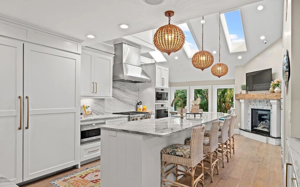 4600 Bay Point Road, Panama City Beach, Florida, is an exceptionally luxurious home with a Tropical Poolside Oasis with smart furnishings, soaring vaulted wood beam ceilings, a curving staircase, and an expansive living room featuring a well-appointed fireplace and triple French doors that lead to the elevated deck. This Home in Panama City Beach offers 6 bedrooms and 8 bathrooms with over 6.000 square feet of living spaces.
