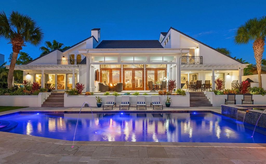 4600 Bay Point Road, Panama City Beach, Florida, is an exceptionally luxurious home with a Tropical Poolside Oasis with smart furnishings, soaring vaulted wood beam ceilings, a curving staircase, and an expansive living room featuring a well-appointed fireplace and triple French doors that lead to the elevated deck. This Home in Panama City Beach offers 6 bedrooms and 8 bathrooms with over 6.000 square feet of living spaces.